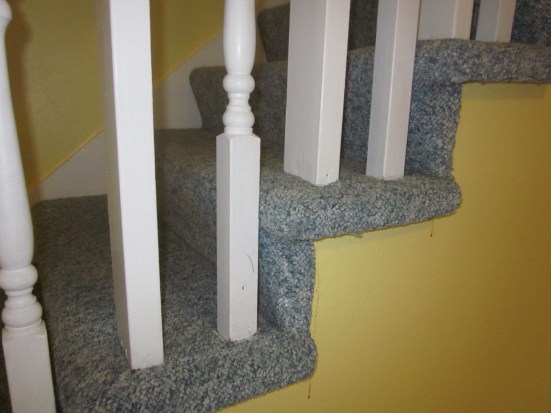 Brown goo below the carpet corners?