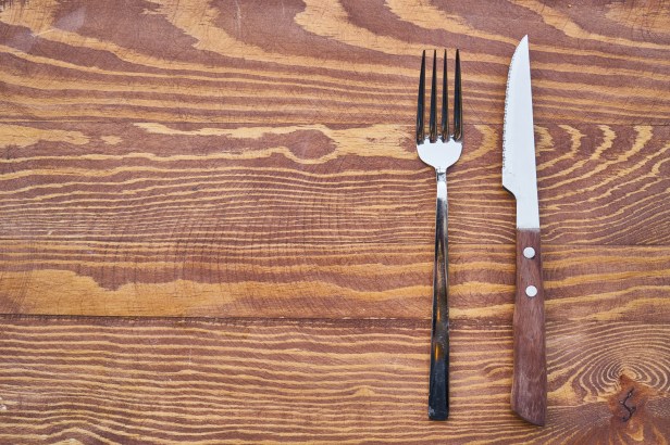 Canva - Fork and Knife on a Wooden Table