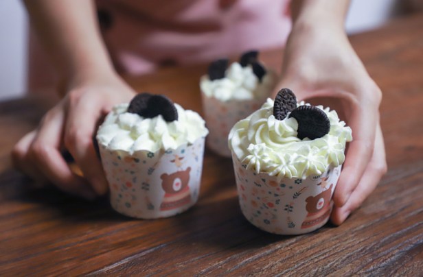 Canva - Person Holding Cupcakes